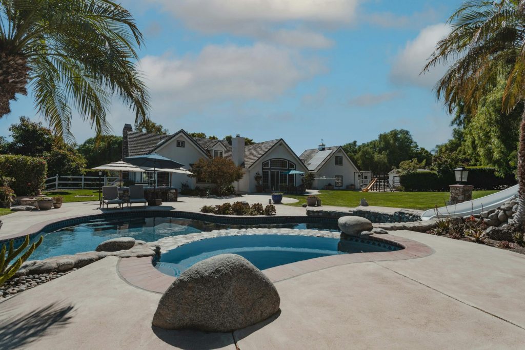 Backyard pool and spa with palms