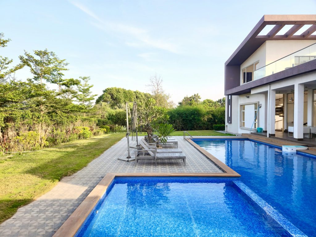 Modern pool beside a contemporary home