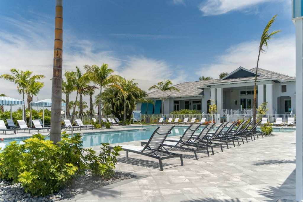 Hotel pool with rows of loungers