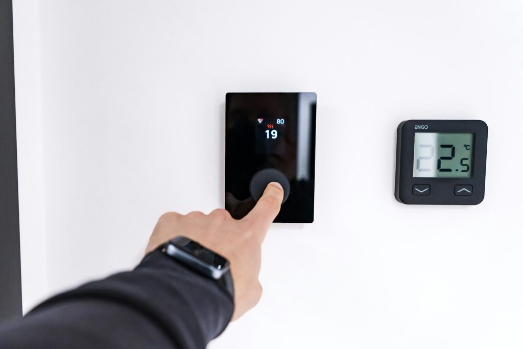 Adjusting settings on a wall-mounted automation control panel