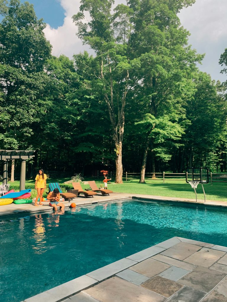 Pool surrounded by mature shade trees