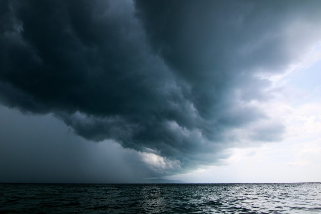Dark storm clouds rolling in over the water