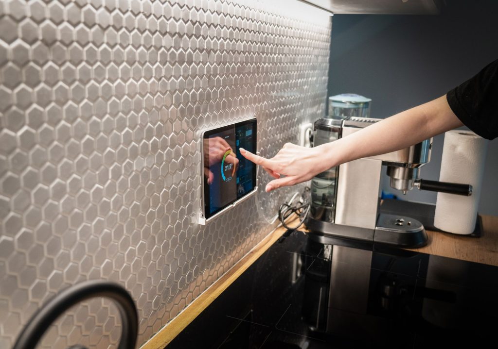 Wall-mounted touchscreen used to control automated equipment